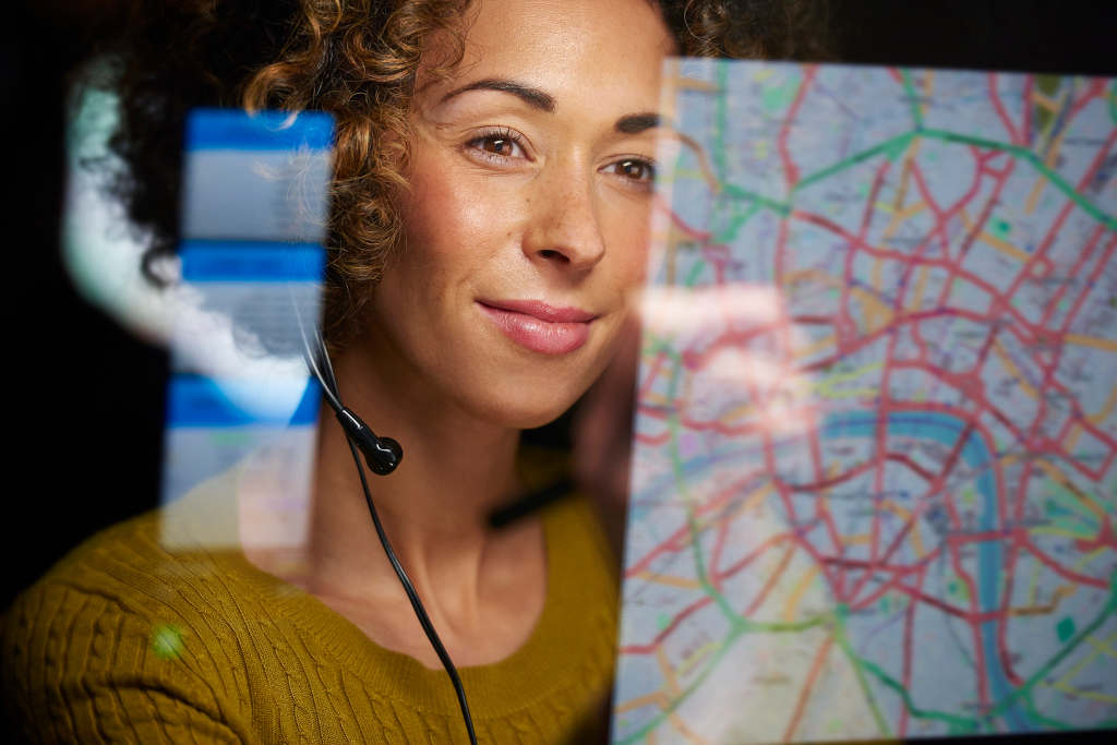 woman pointing to technology